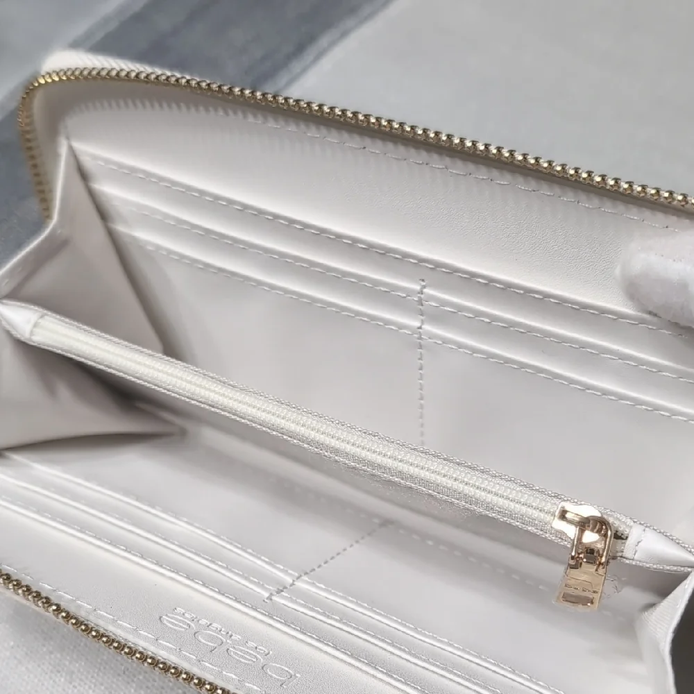bebe White Zip Wristlet Clutch with Gold Logo